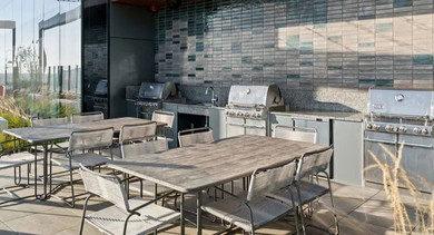Avra West Loop in Chicago offers a rooftop grilling station with ample outdoor dining space
