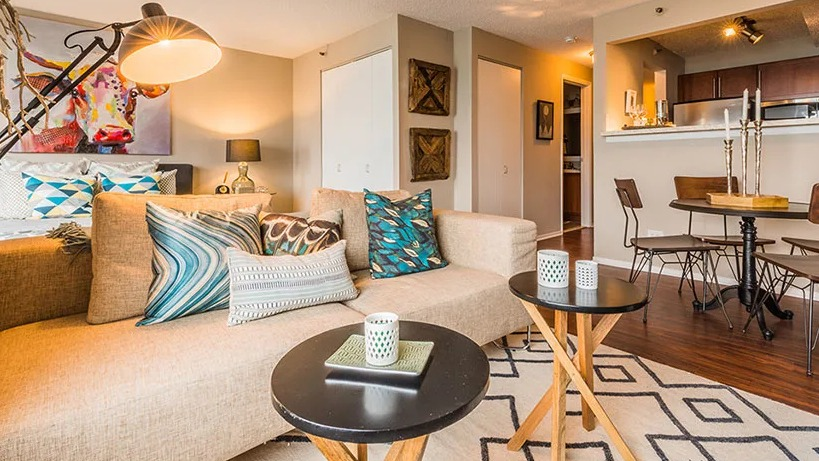 A cozy studio apartment at Axis Apartments & Lofts in Chicago, combining living, dining, and sleeping areas