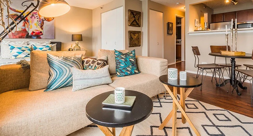 A cozy studio apartment at Axis Apartments & Lofts in Chicago, combining living, dining, and sleeping areas