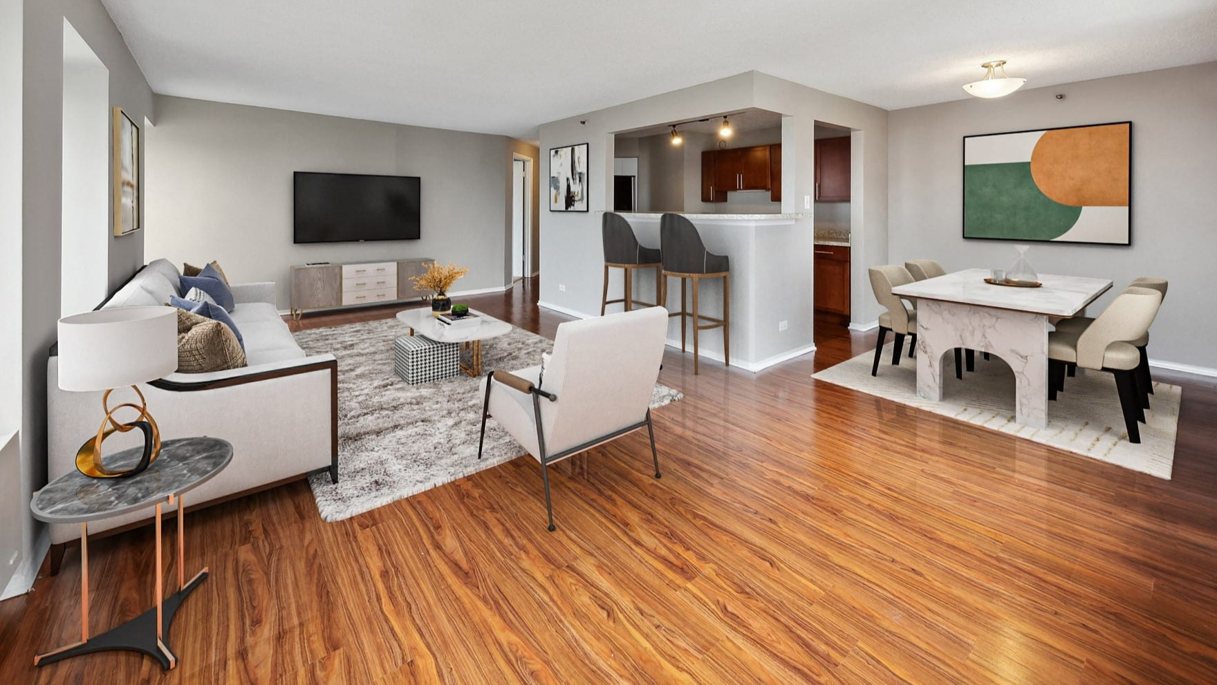 Open-concept living and dining area with hardwood floors at Axis Apartments & Lofts in Chicago