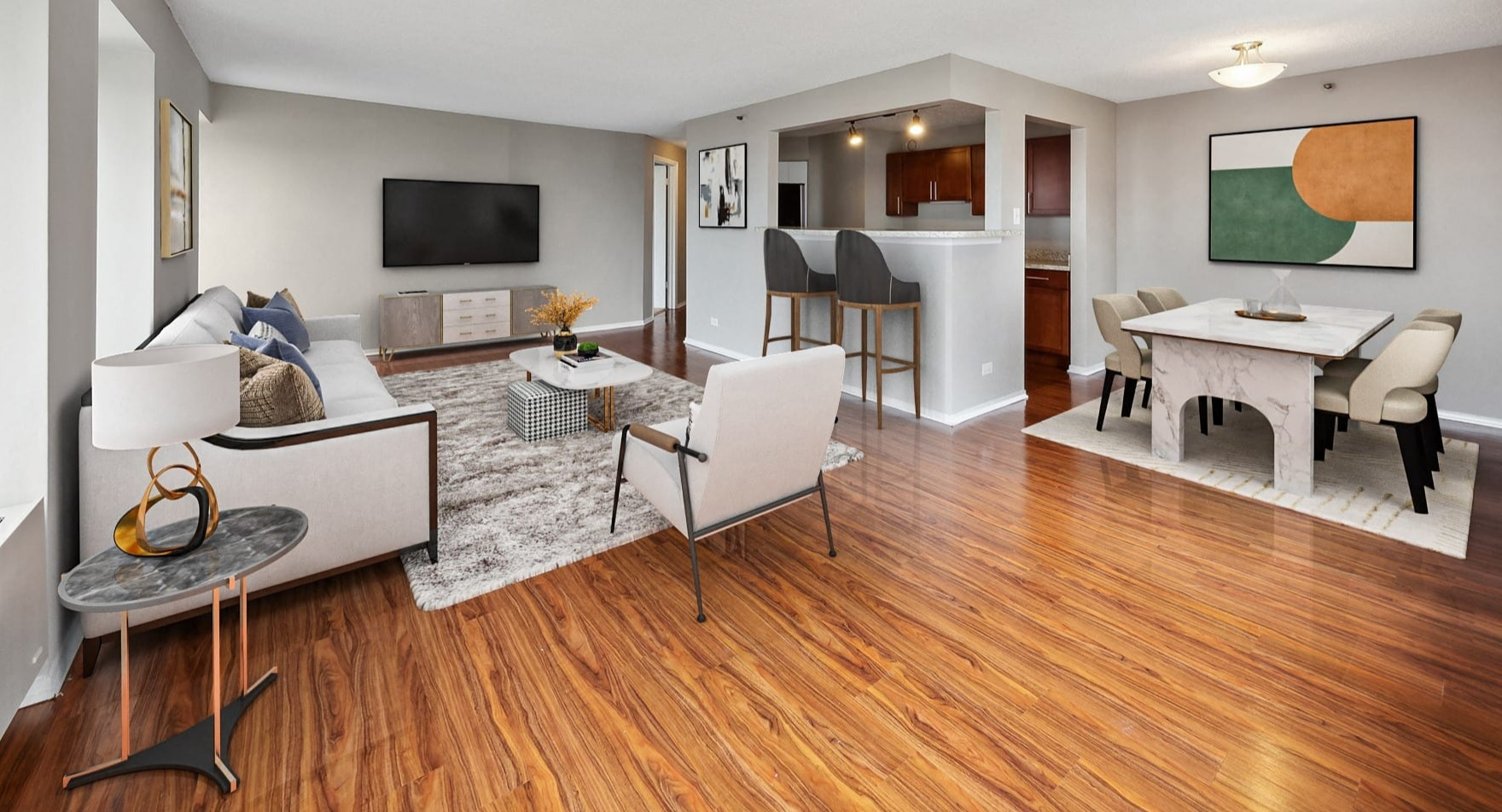 Open-concept living and dining area with hardwood floors at Axis Apartments & Lofts in Chicago