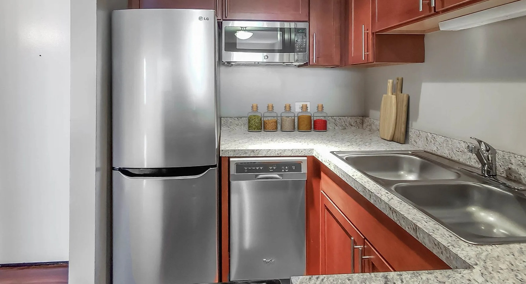 Modern kitchen with stainless steel appliances and ample cabinet space at Axis Apartments & Lofts in Chicago