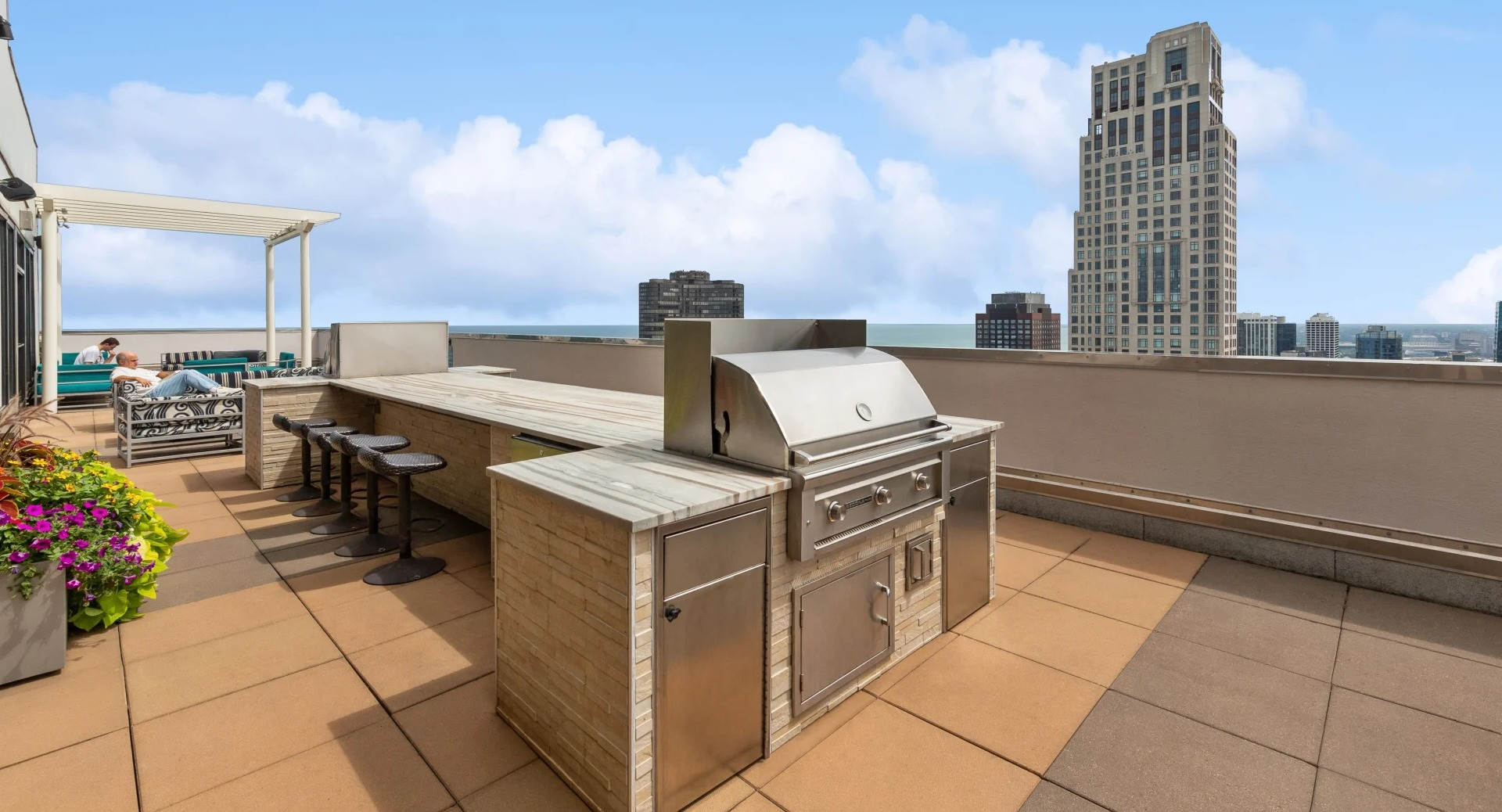 Axis Apartments & Lofts in Chicago offer a stunning rooftop with grilling stations and city views