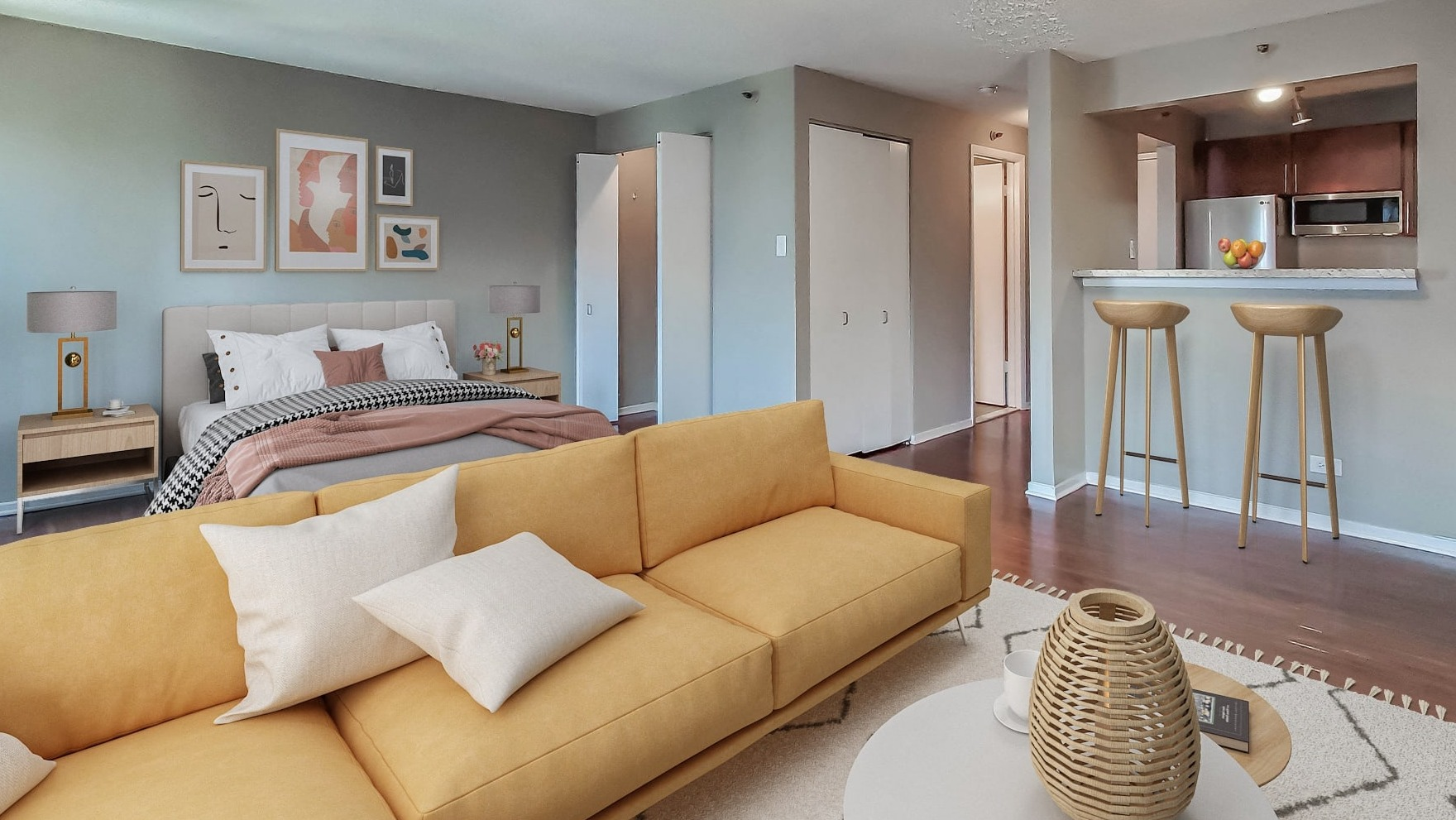 Open-plan studio apartment at Axis Apartments & Lofts in Chicago, combining living and sleeping areas with a kitchen