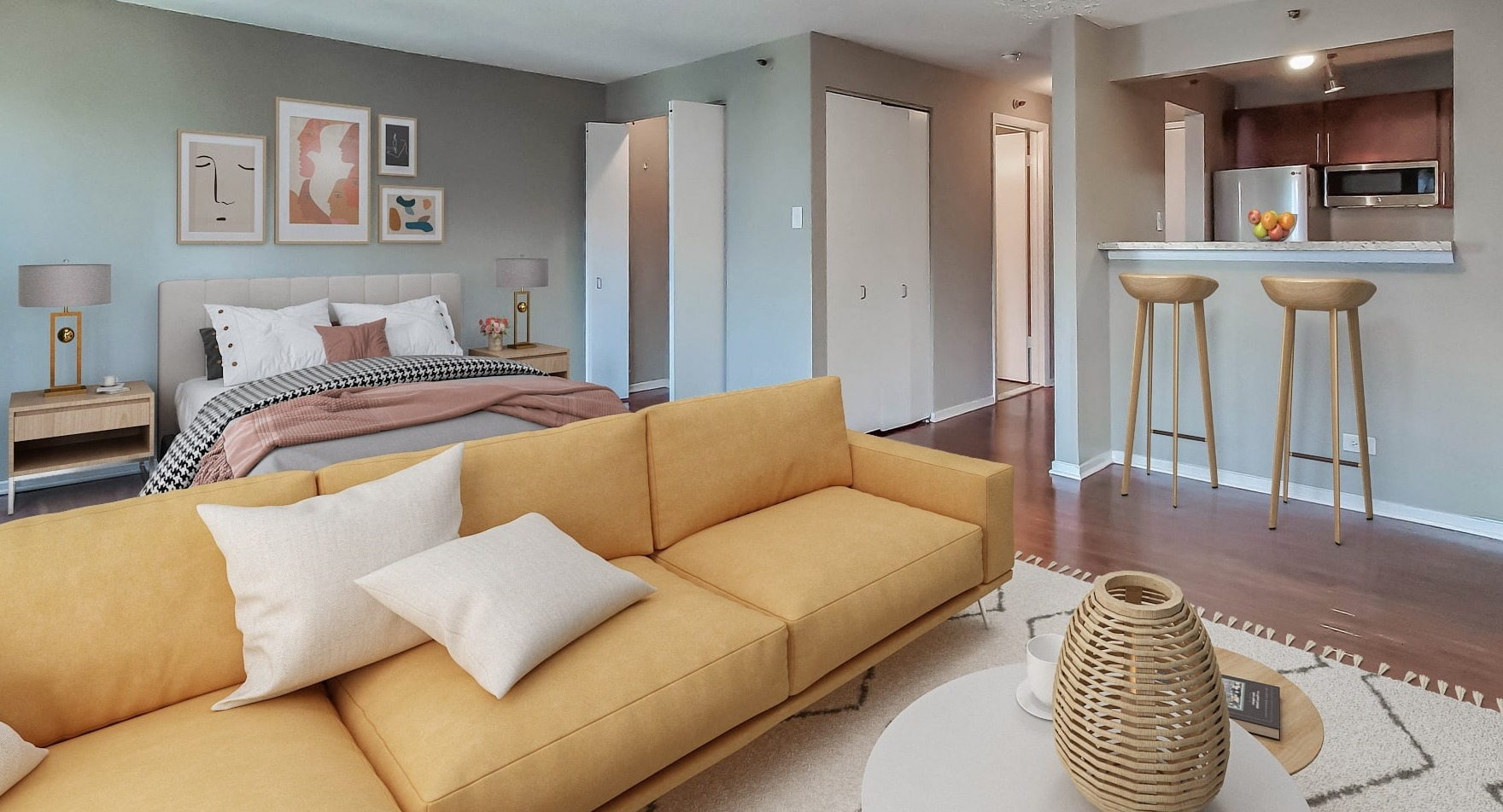 Open-plan studio apartment at Axis Apartments & Lofts in Chicago, combining living and sleeping areas with a kitchen