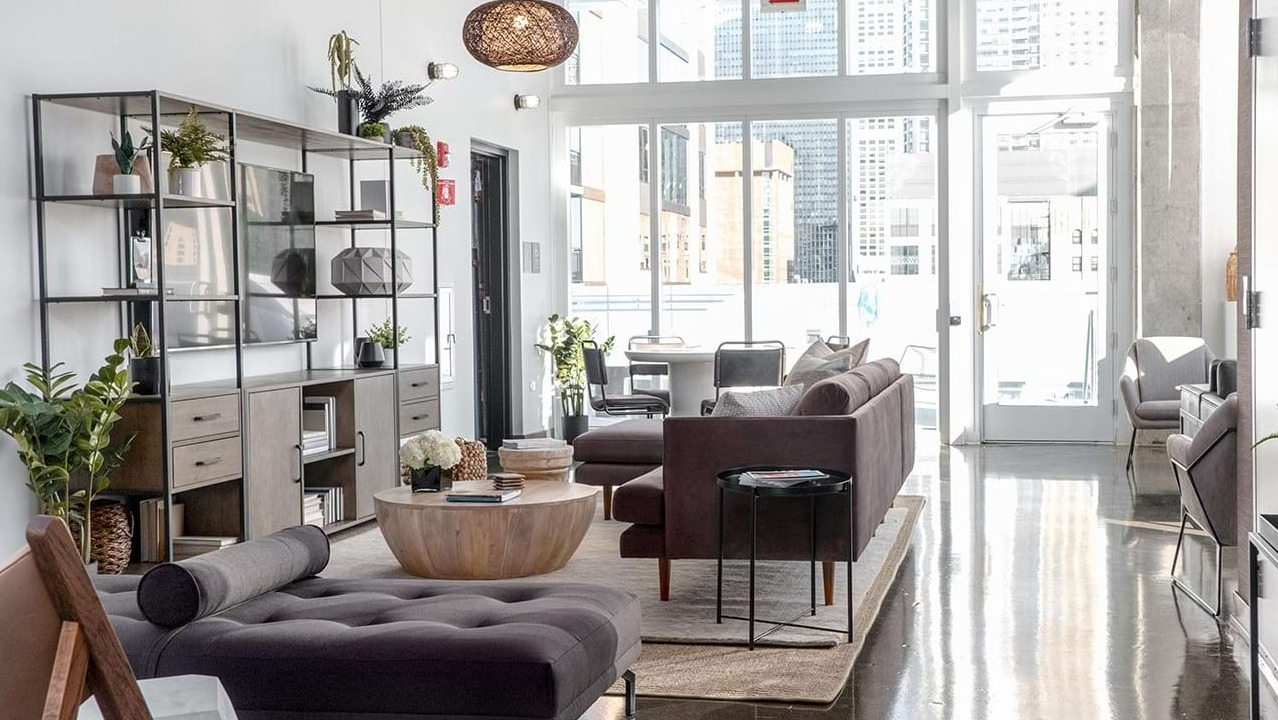 Sophisticated lobby lounge at The Bush Temple in Chicago, featuring plush sofas, stylish decor, and a welcoming ambiance