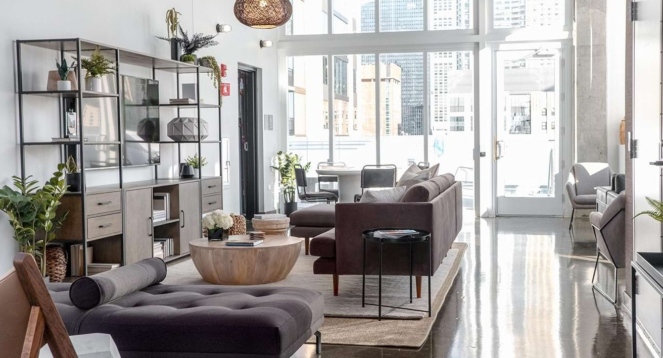 Sophisticated lobby lounge at The Bush Temple in Chicago, featuring plush sofas, stylish decor, and a welcoming ambiance