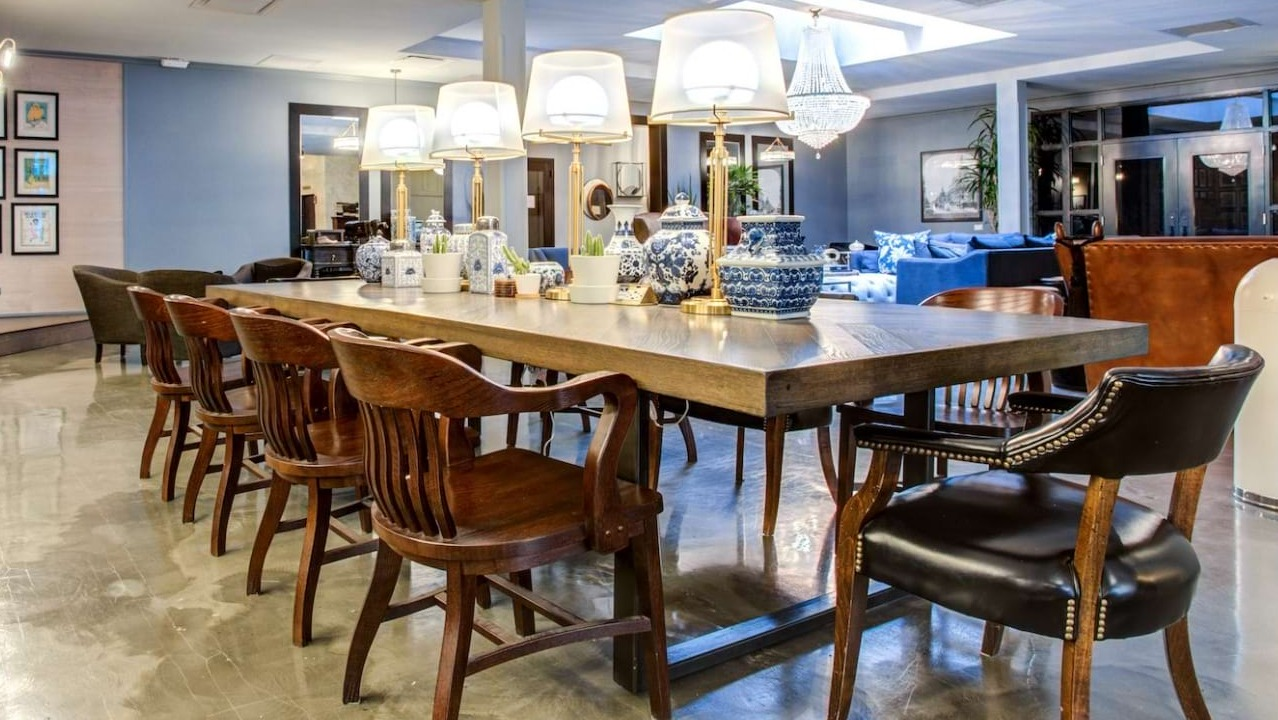 Elegant resident lounge at The Bush Temple in Chicago, featuring a large communal dining table and luxurious seating areas