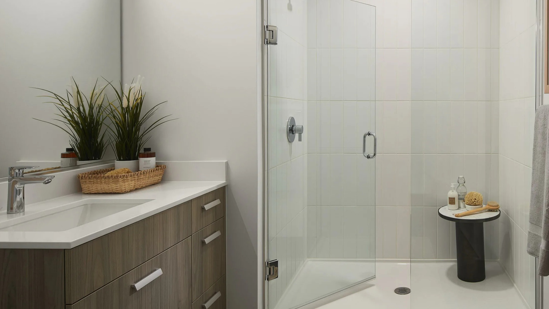 Modern bathroom with a spacious walk-in shower, stylish vanity, and contemporary fixtures at Cascade Lakeshore East in Chicago