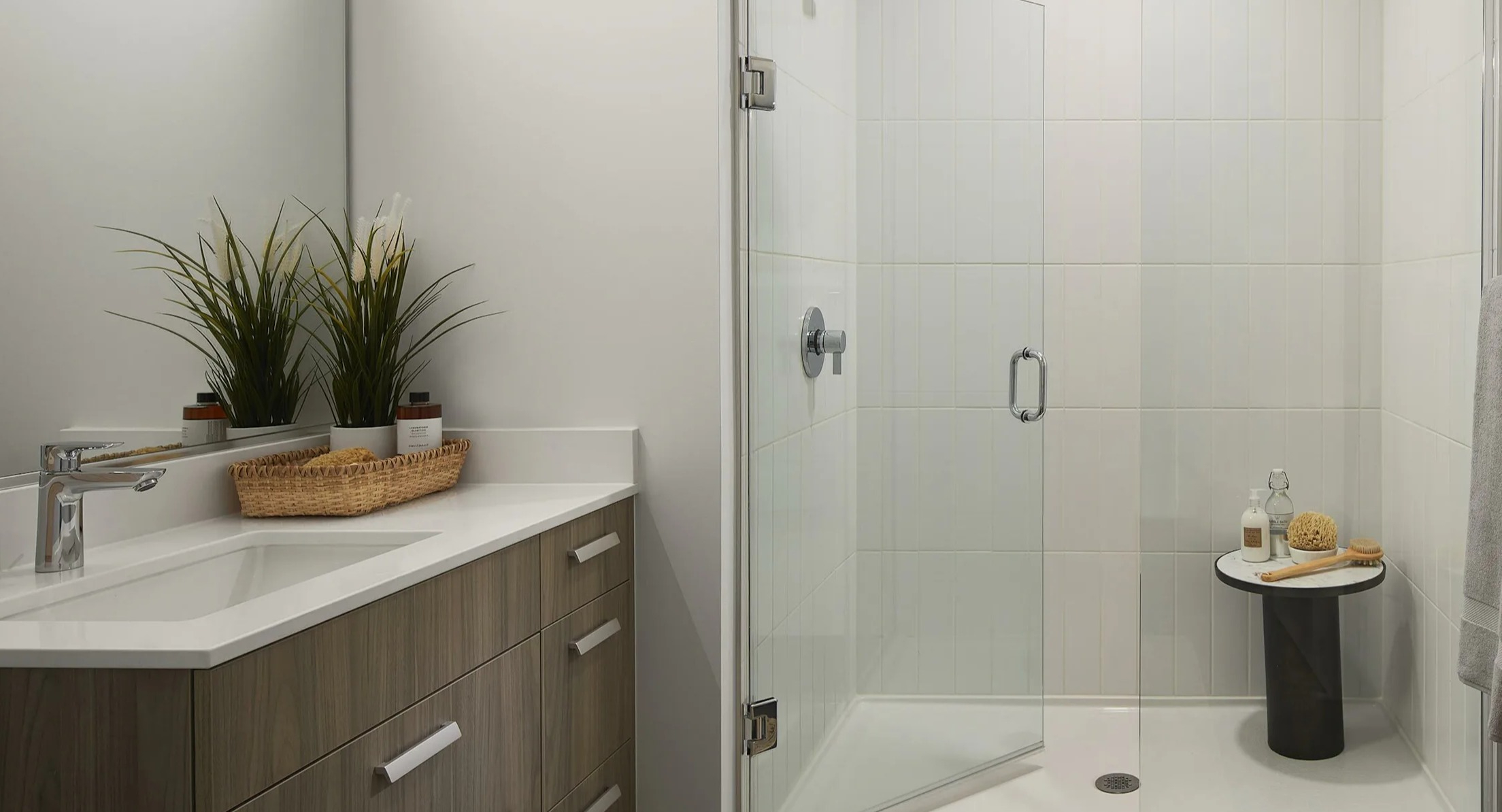 Modern bathroom with a spacious walk-in shower, stylish vanity, and contemporary fixtures at Cascade Lakeshore East in Chicago