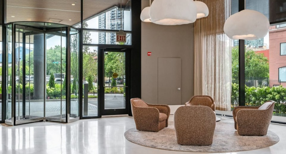 Grand and elegant apartment lobby featuring contemporary seating arrangements and stylish lighting at Cassidy on Canal apartments in Chicago