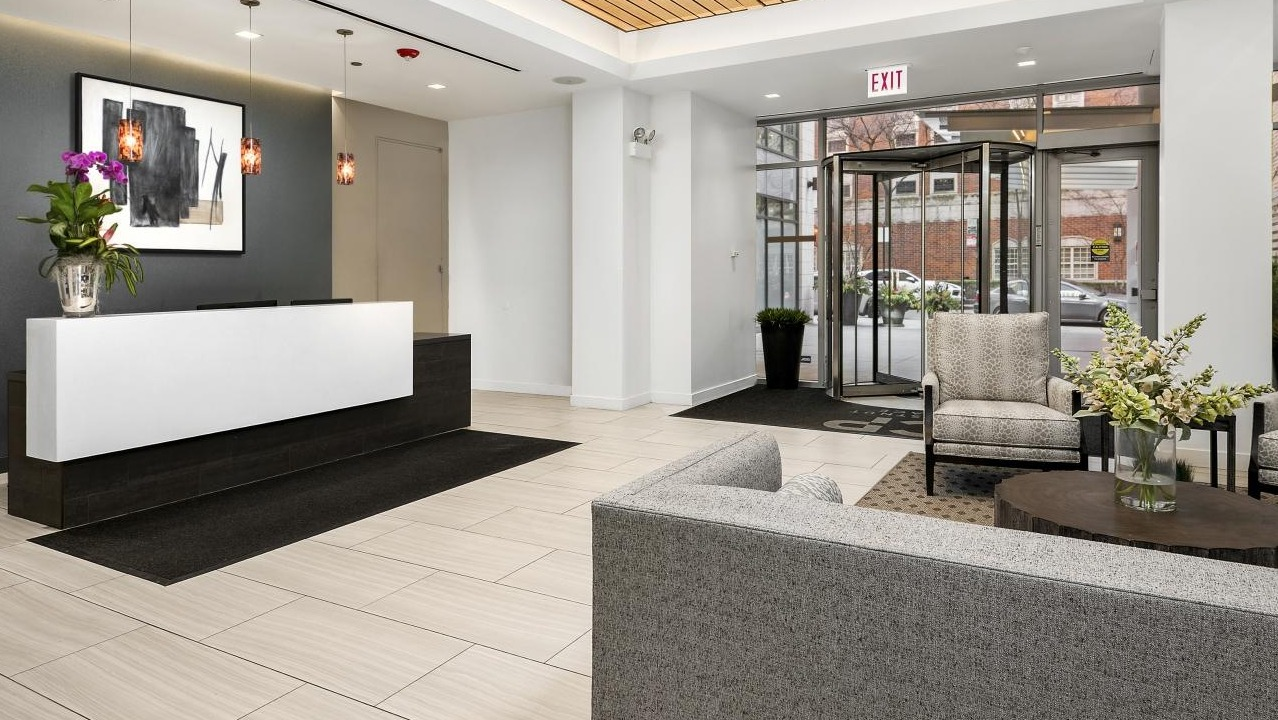 Elegant lobby and reception area at Chestnut Place apartments in Chicago, with modern seating and stylish decor