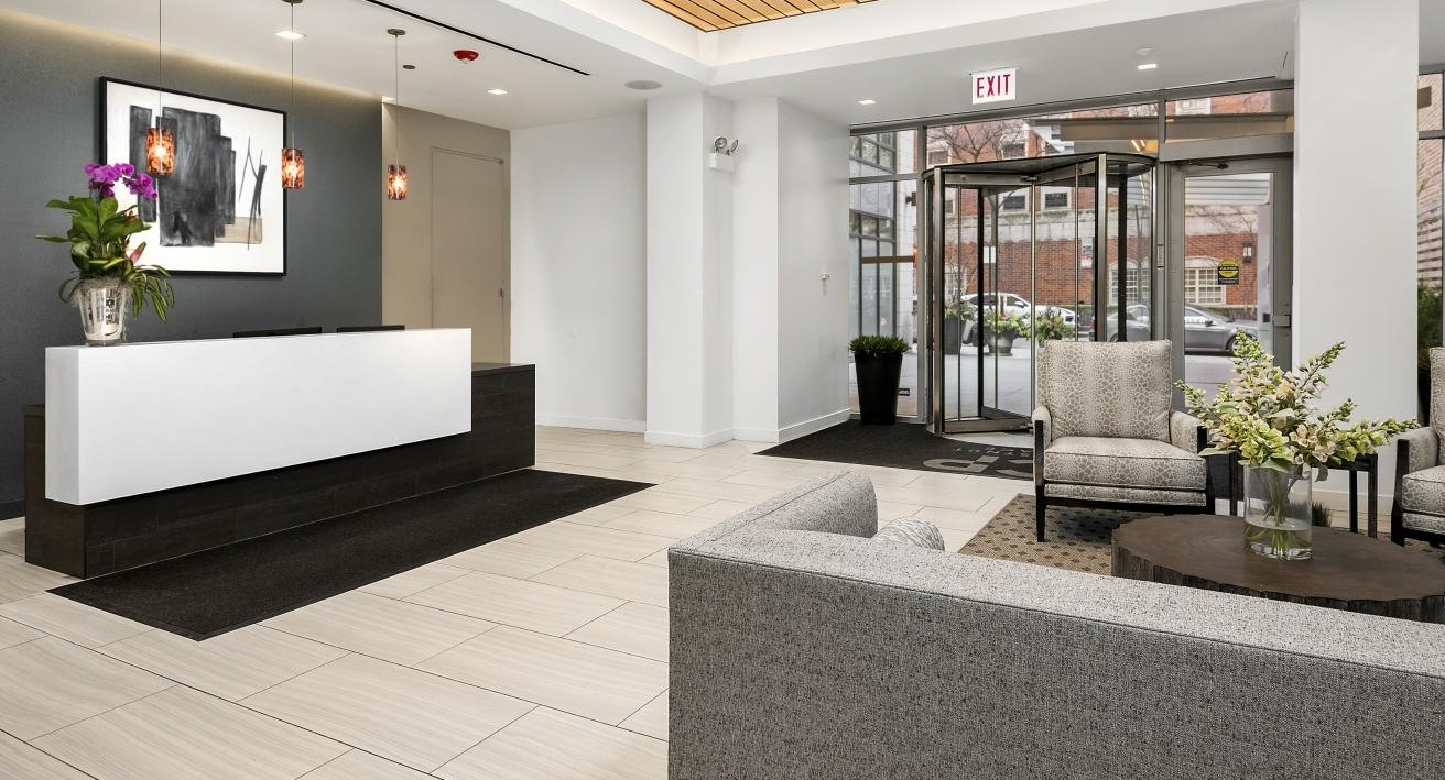 Elegant lobby and reception area at Chestnut Place apartments in Chicago, with modern seating and stylish decor