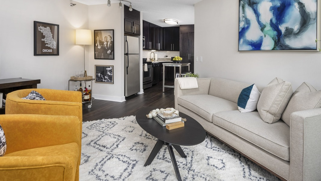 Inviting open-concept living area and kitchen at Cityfront Place, perfect for entertaining with modern furniture