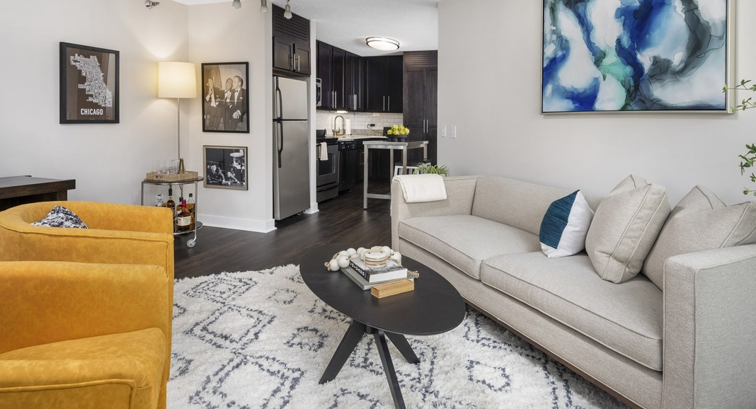 Inviting open-concept living area and kitchen at Cityfront Place, perfect for entertaining with modern furniture