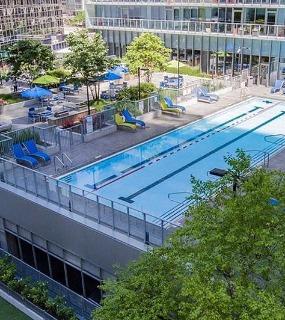 Aerial view of the outdoor pool and amenity deck at Coast at Lakeshore East apartments in Chicago
