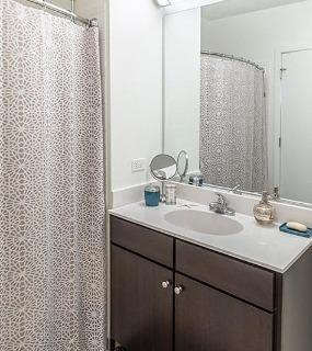 Clean and modern bathroom at Coast at Lakeshore East apartments in Chicago