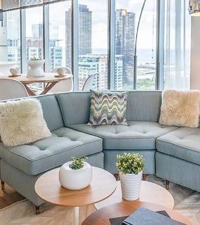 Another view of the modern living room at Coast at Lakeshore East apartments in Chicago
