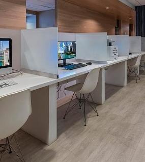 Computer stations in the business center at Coast at Lakeshore East apartments in Chicago