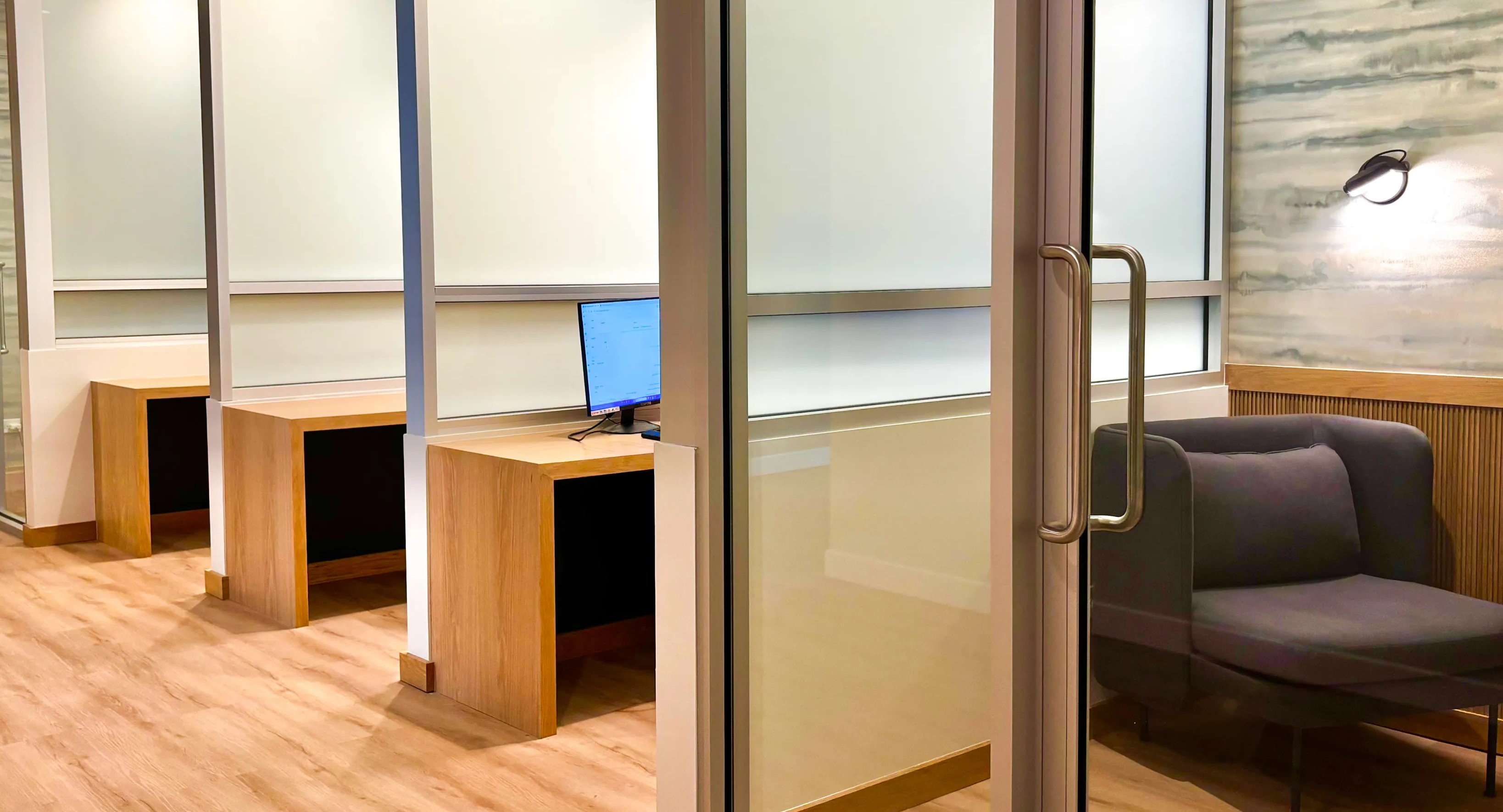 Dedicated coworking spaces and private booths at Coast at Lakeshore East, perfect for remote work or studying