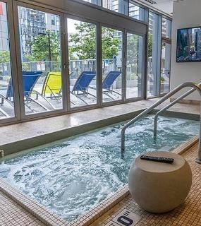 Indoor spa area with hot tub at Coast at Lakeshore East apartments in Chicago. Relaxing and luxurious amenities