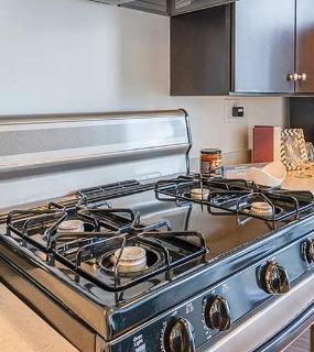Close-up of the modern kitchen appliances at Coast at Lakeshore East apartments in Chicago