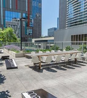 Outdoor dining area at Coast at Lakeshore East apartments in Chicago