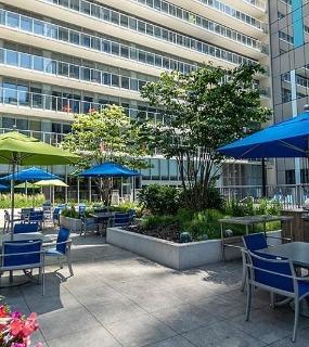 Outdoor grilling area at Coast at Lakeshore East apartments in Chicago