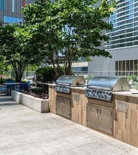 Outdoor grilling area at Coast at Lakeshore East apartments in Chicago