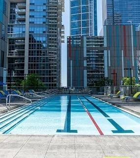 Another view of the outdoor swimming pool at Coast at Lakeshore East apartments in Chicago