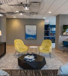 Comfortable resident lounge area with modern decor at Coast at Lakeshore East apartments in Chicago