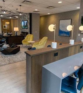Resident lounge with work space and comfortable seating at Coast at Lakeshore East apartments in Chicago