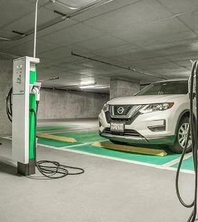 Electric vehicle charging station in the parking area of Coast at Lakeshore East apartments