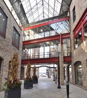 Cobbler Square Lofts apartment building with a beautiful brick facade and large windows in Chicago