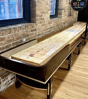 Spacious entertainment room featuring games, seating, and a social atmosphere at Cobbler Square Lofts in Chicago