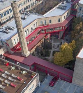 Scenic exterior view of Cobbler Square Lofts, showcasing its modern yet historic architectural design in Chicago