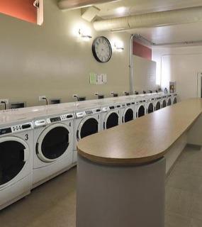 Convenient in-building laundry room with washers and dryers at Cobbler Square Lofts in Chicago