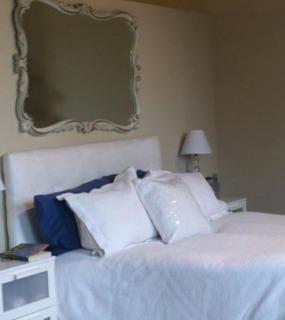 Modern bedroom with sleek furnishings, neutral tones, and soft lighting at Cobbler Square Lofts in Chicago