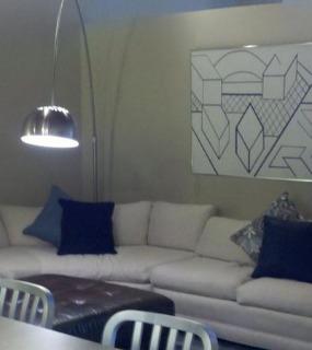 Open-concept living space with stylish furnishings and a welcoming ambiance at Cobbler Square Lofts in Chicago