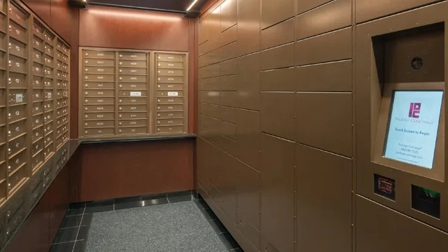 A modern mailroom with secure package lockers and traditional mailboxes, well-lit and organized