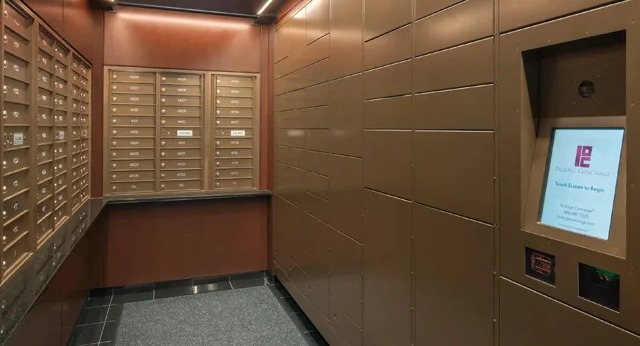 A modern mailroom with secure package lockers and traditional mailboxes, well-lit and organized