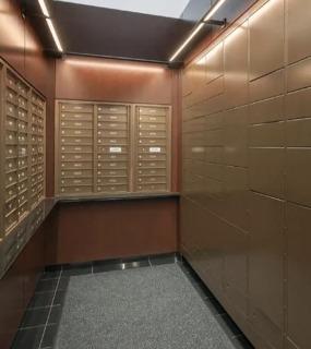 Secure package room with individual mailboxes and a digital package management system at Columbus Plaza