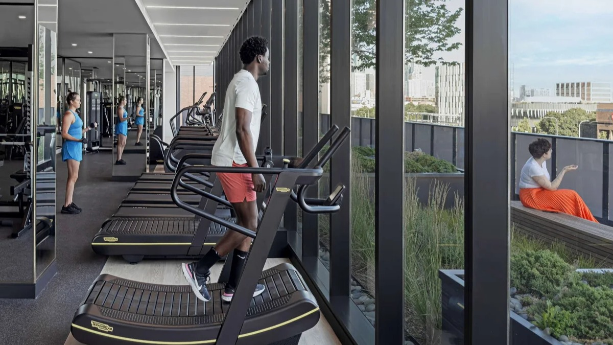 State-of-the-art fitness center and gym at Coppia apartments in Chicago with treadmills and city views