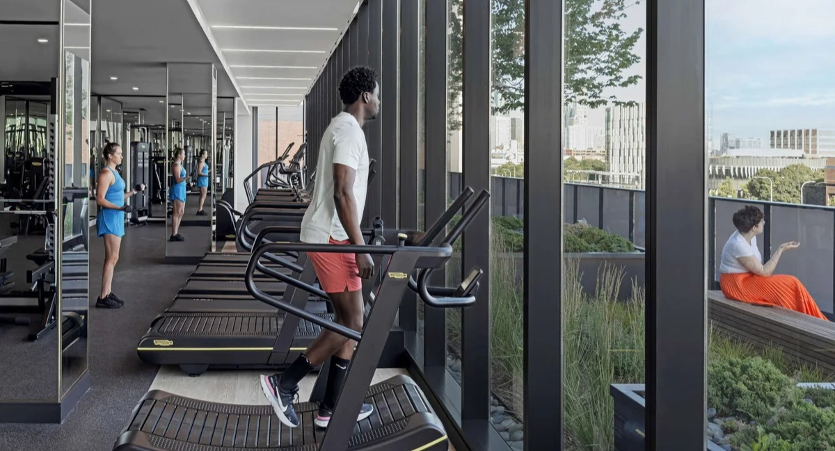 State-of-the-art fitness center and gym at Coppia apartments in Chicago with treadmills and city views