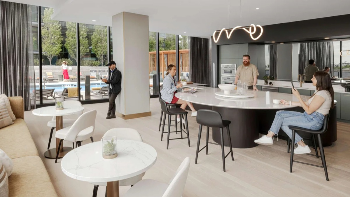 Stylish resident lounge and communal kitchen at Coppia apartments in Chicago, perfect for socializing and dining