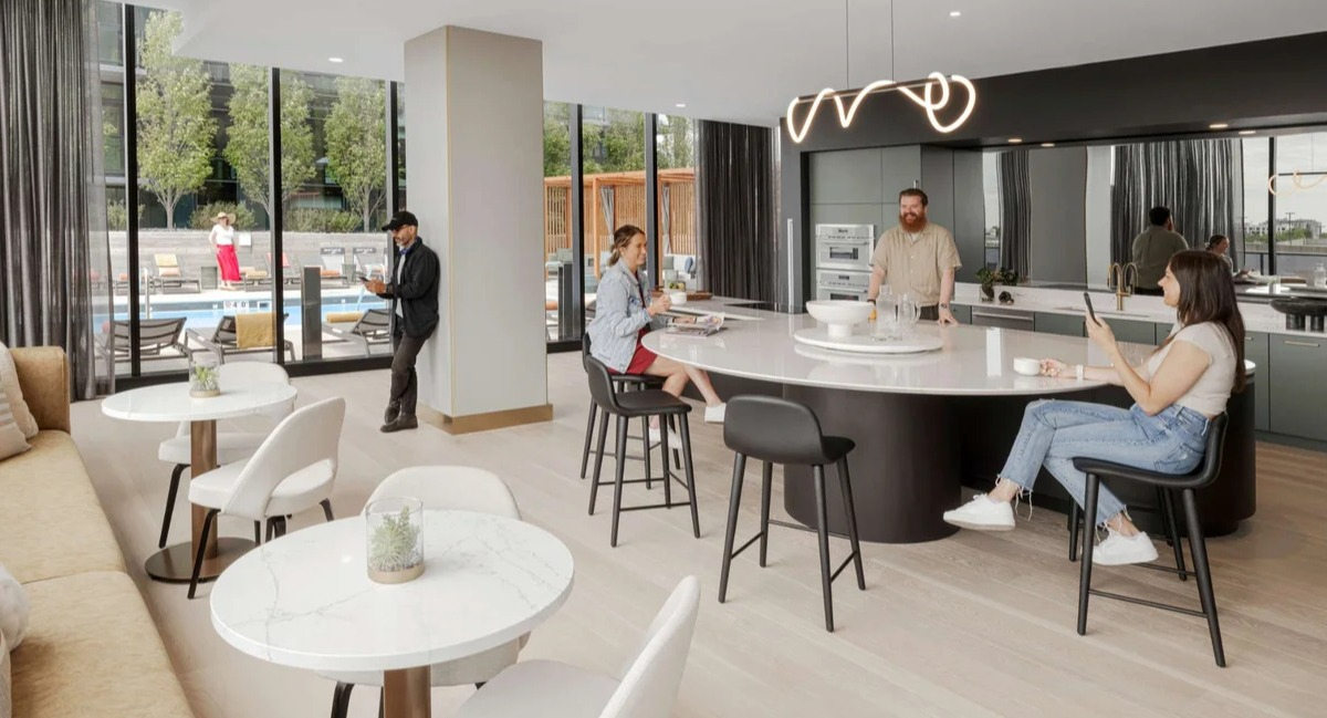 Stylish resident lounge and communal kitchen at Coppia apartments in Chicago, perfect for socializing and dining