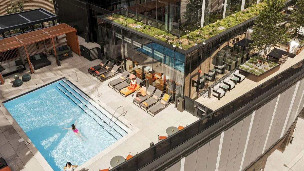 Stunning rooftop pool and sundeck at Coppia apartments in Chicago, offering a refreshing escape and city views
