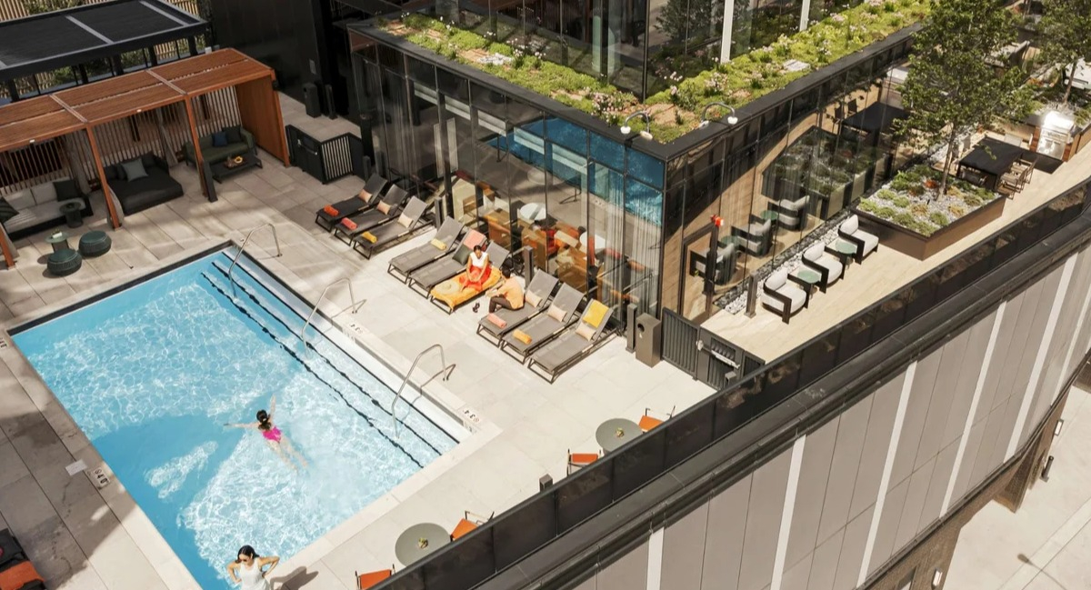 Stunning rooftop pool and sundeck at Coppia apartments in Chicago, offering a refreshing escape and city views