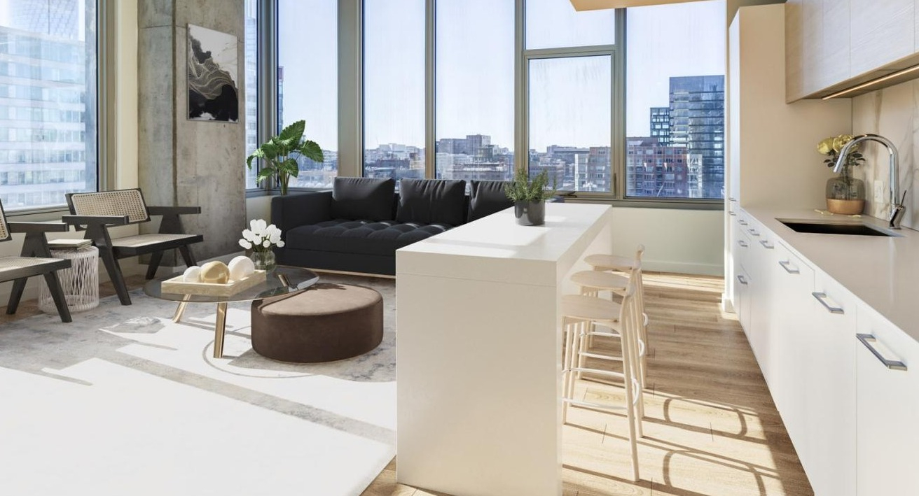 Chic open-concept kitchen and living area with a breakfast bar, modern seating, and large windows overlooking city views at EMME Chicago in Chicago