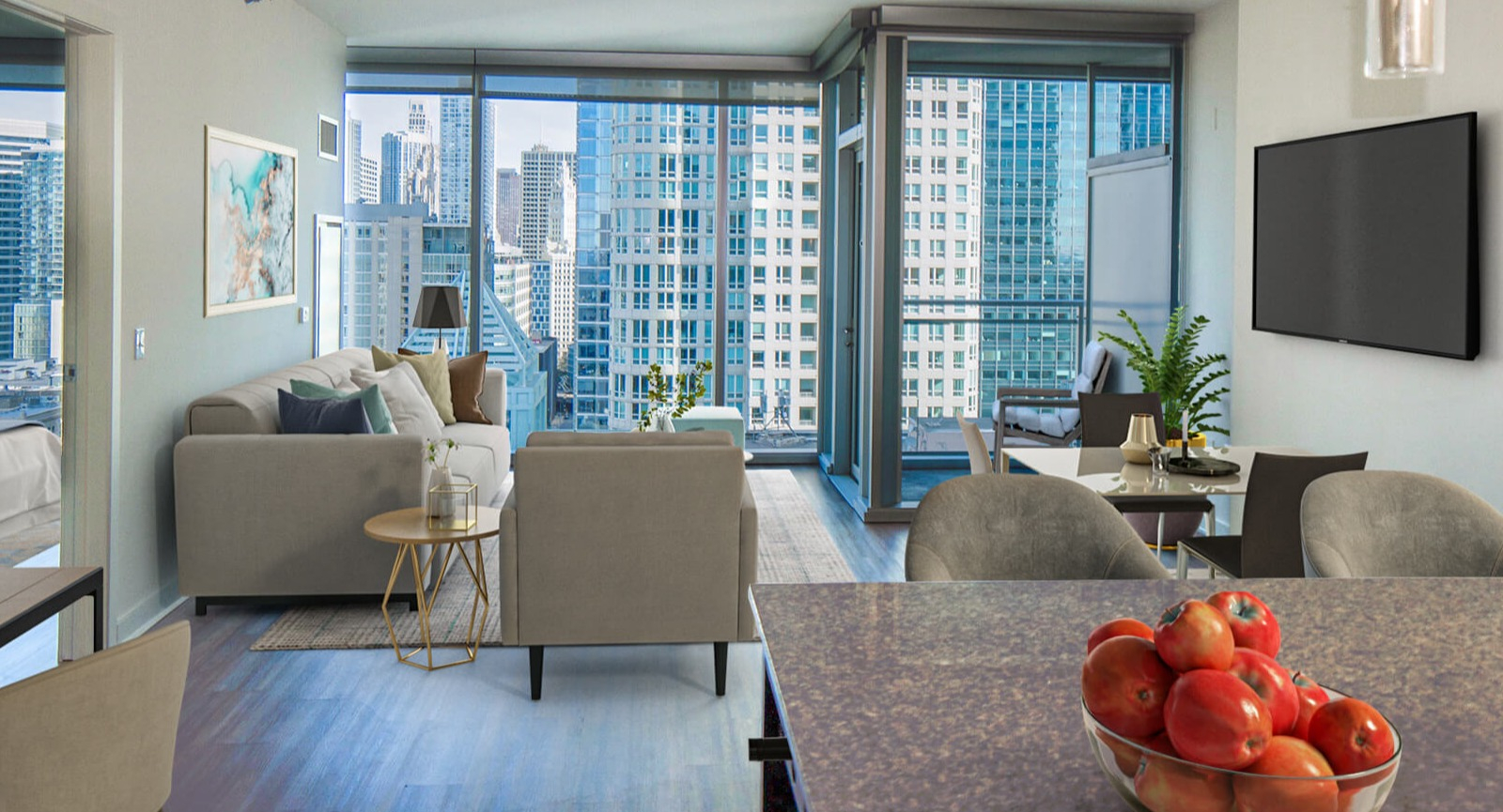 Env Chicago living and dining combination area with comfortable seating and expansive city views from large windows